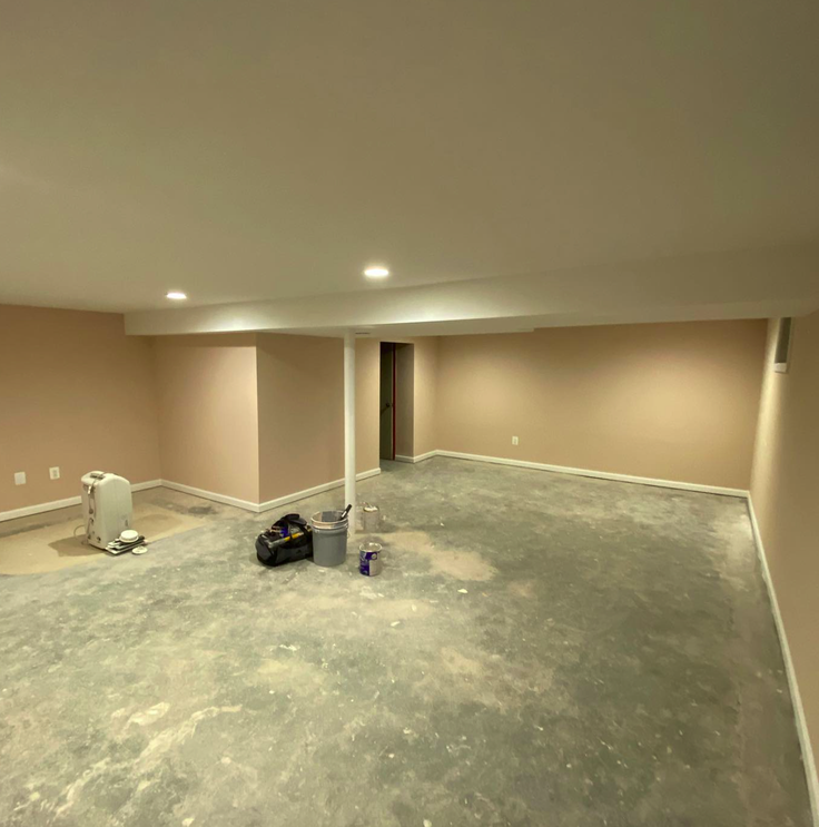 Transformed Springfield basement with painted walls and finished flooring